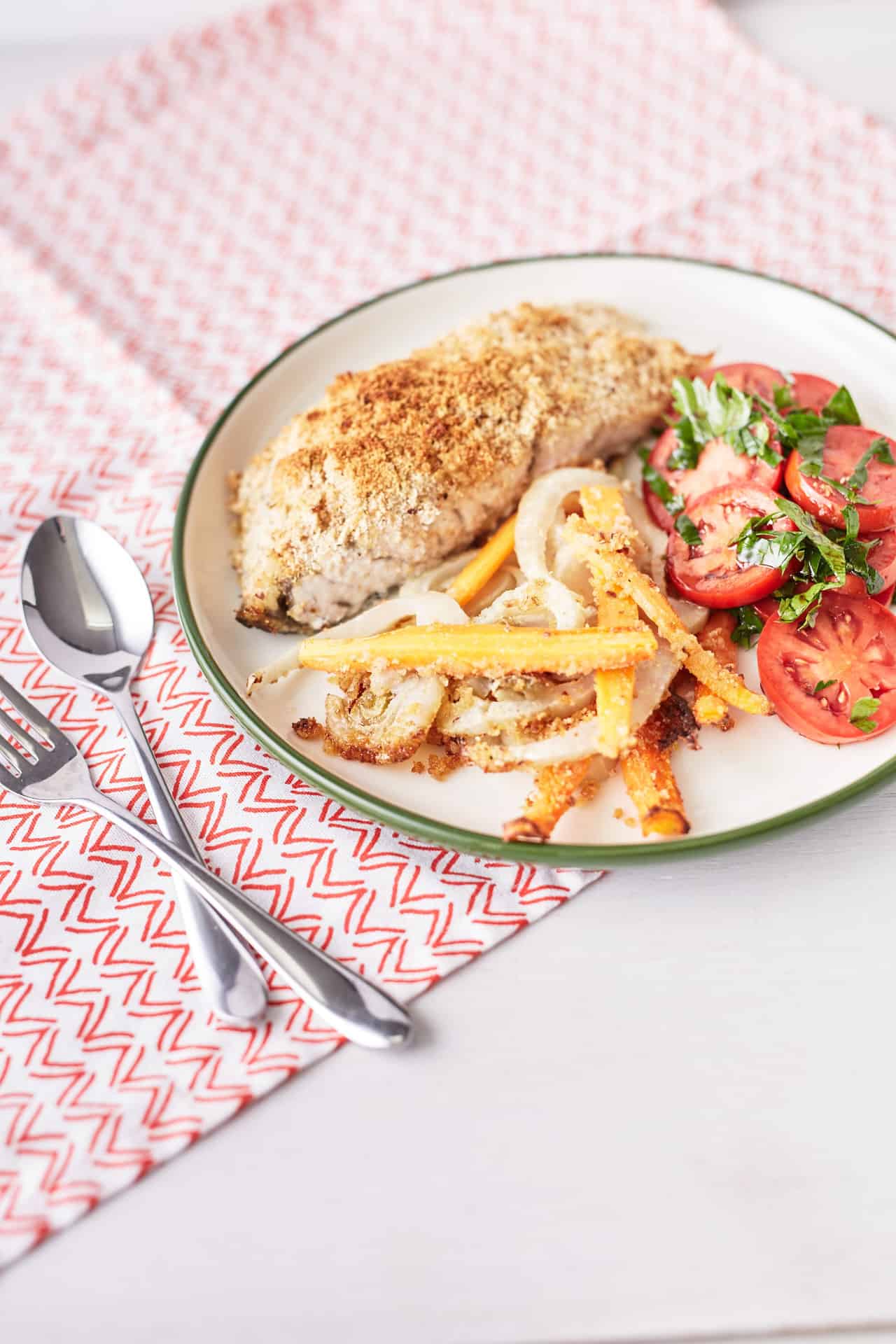 Baked Seabass with golden crust with baked fennel, carrots and a fresh tomato salad