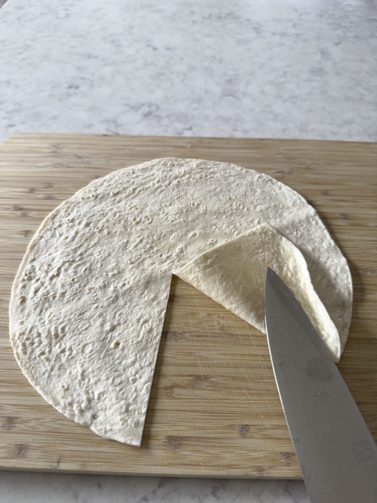 A tortilla wrap with a single cut from the centre of the wrap to the edge