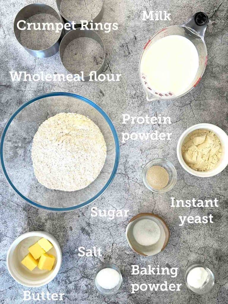 Measured ingredients for the crumpet in small containers: milk, wholemeal flour, protein powder, etc.