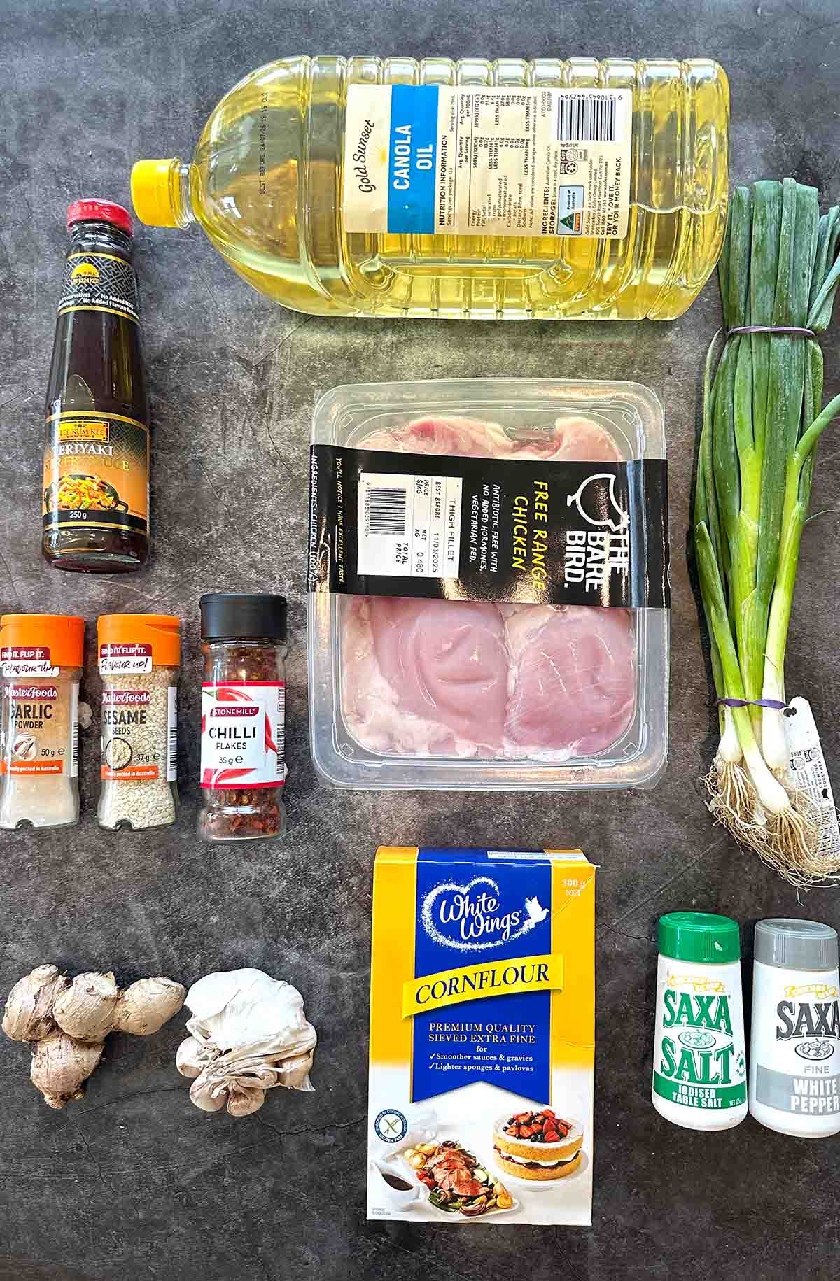 All the ingredients for the Osaka Chicken recipe neatly laid out on a bench, including chicken, seasonings, and sauce components.