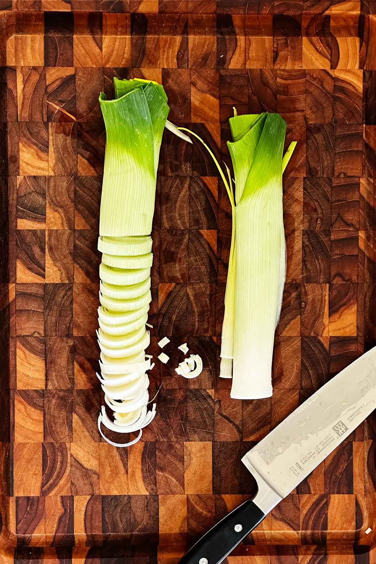 Slice leeks into thin half-moons for soup or sautéing