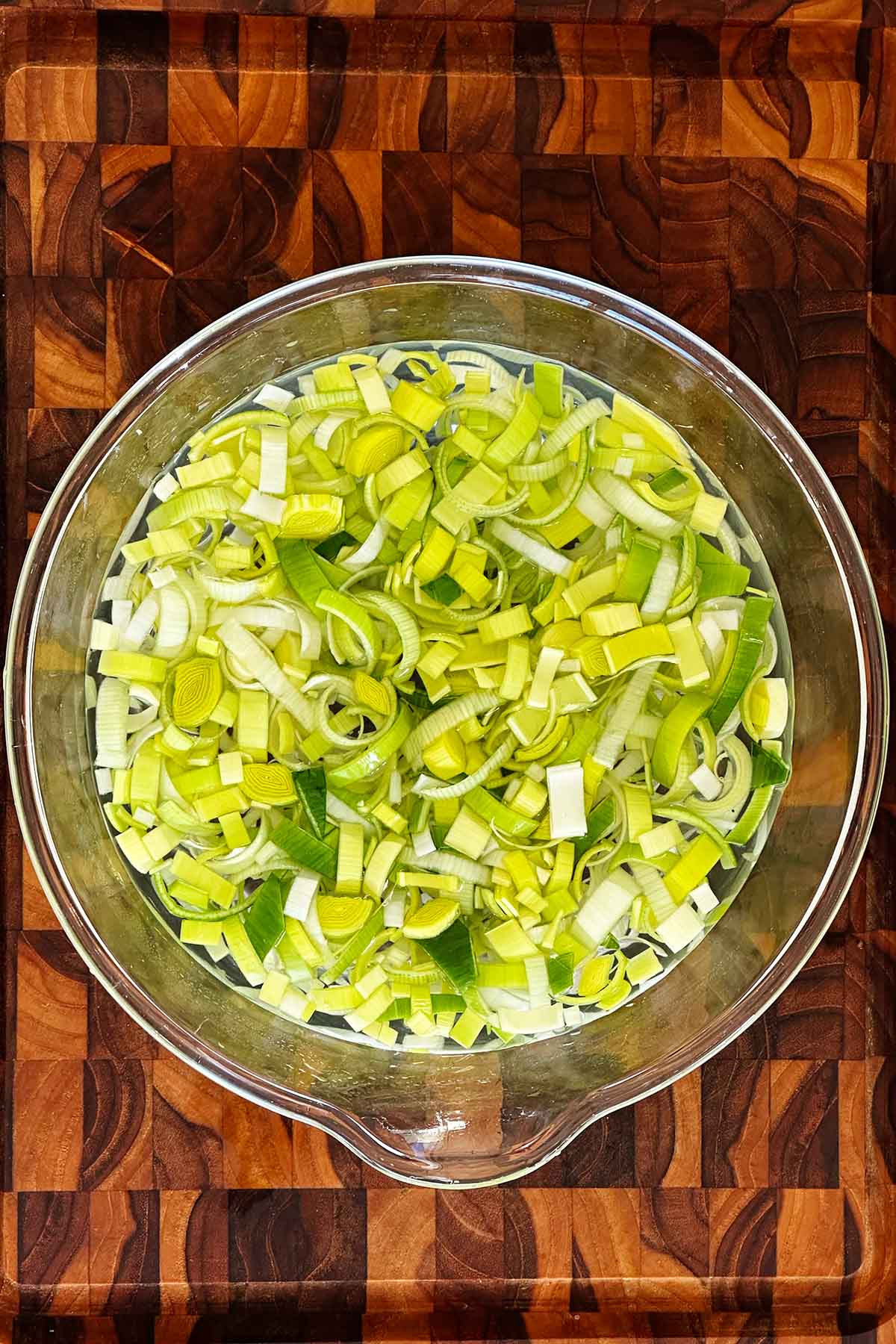 Soak sliced leeks in cold water to loosen and remove grit