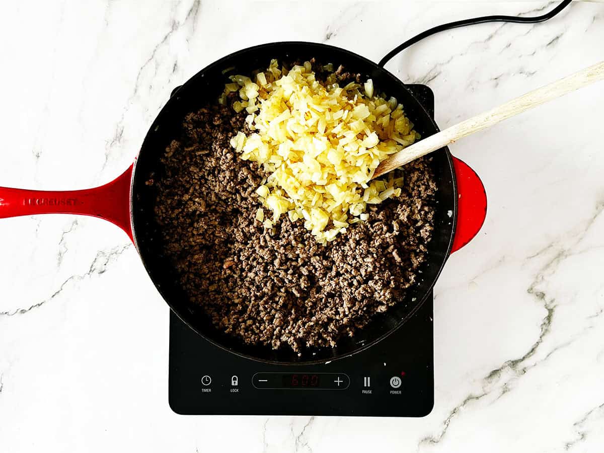 Cooked onions added back to browned mince in skillet