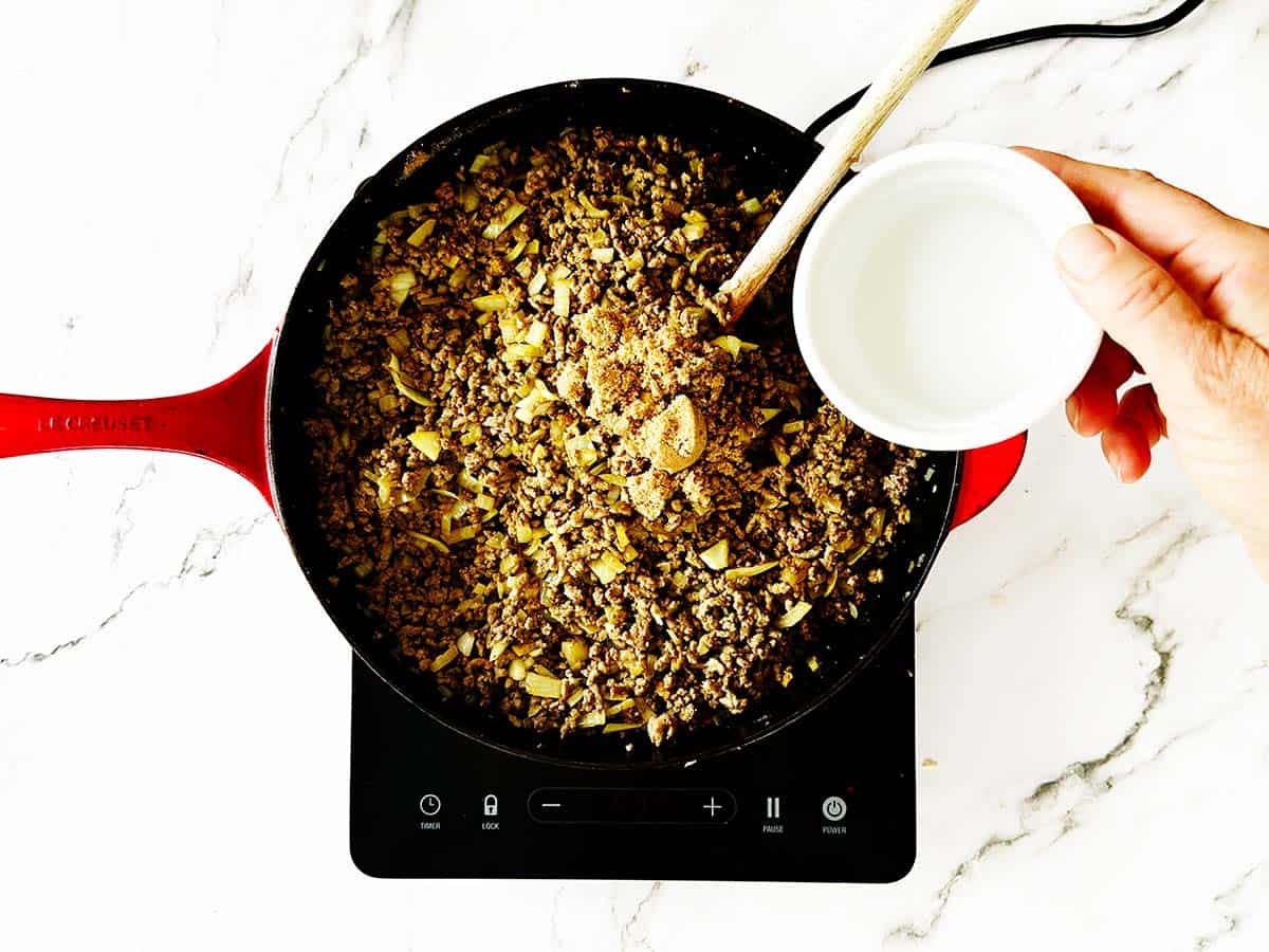 Brown sugar and vinegar added to mince mixture in skillet