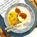 Bobotie with yellow rice, chutney drizzle, Afrikaans napkin and cutlery