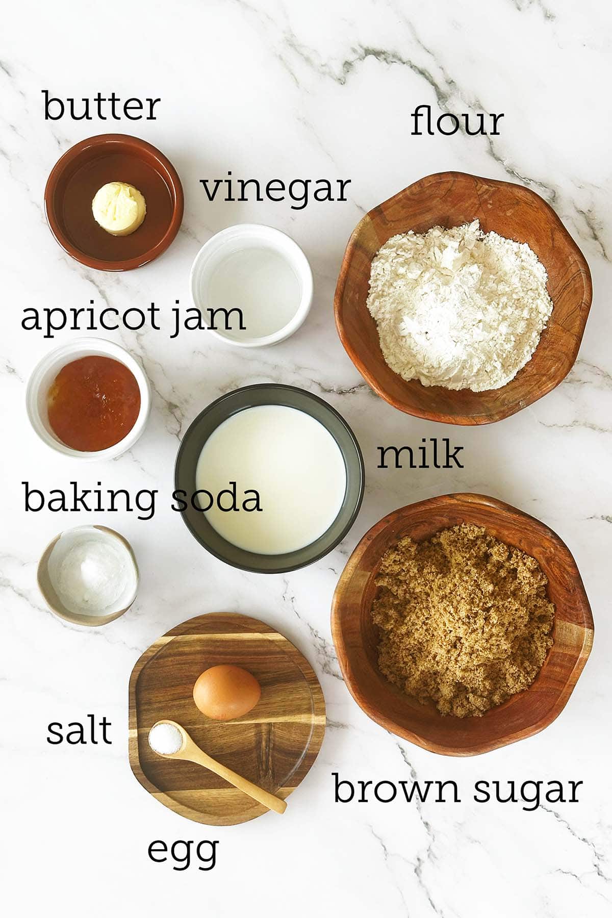 Measured Malva pudding ingredients with brown sugar, apricot jam, flour, milk and butter