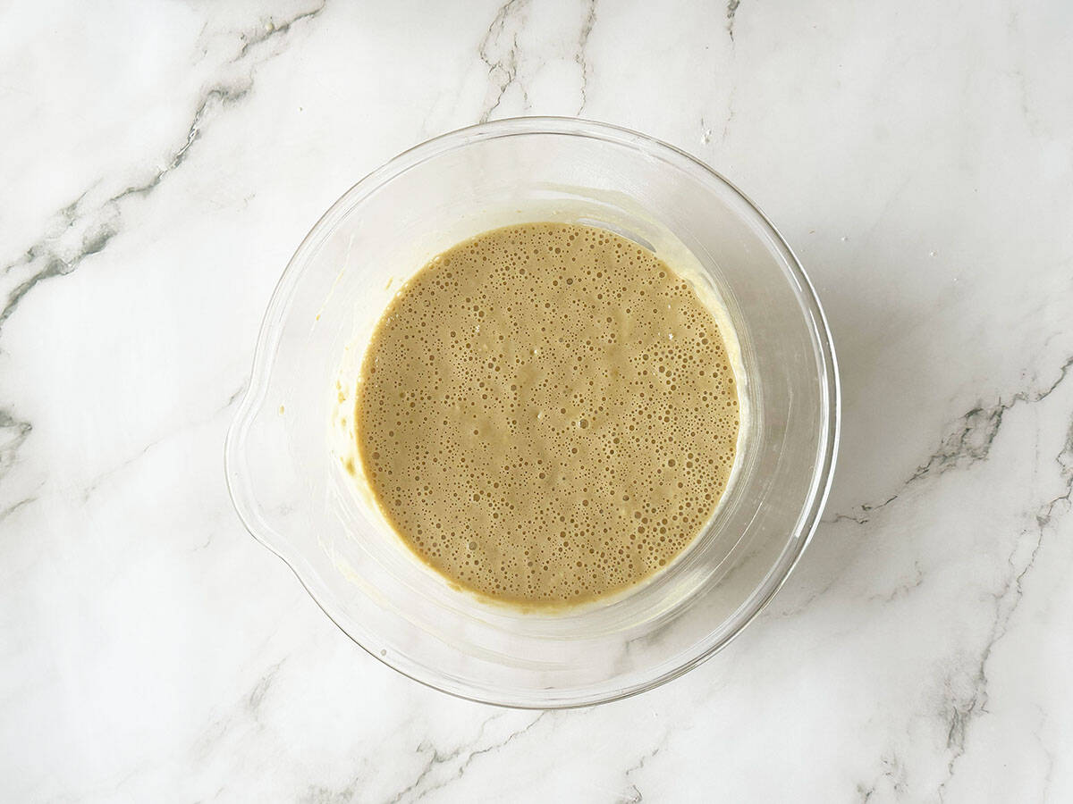 Smooth Malva pudding batter ready for baking in mixing bowl