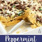 Peppermint crisp tart in a white dish with one slice removed showing caramel cream and mint chocolate layers