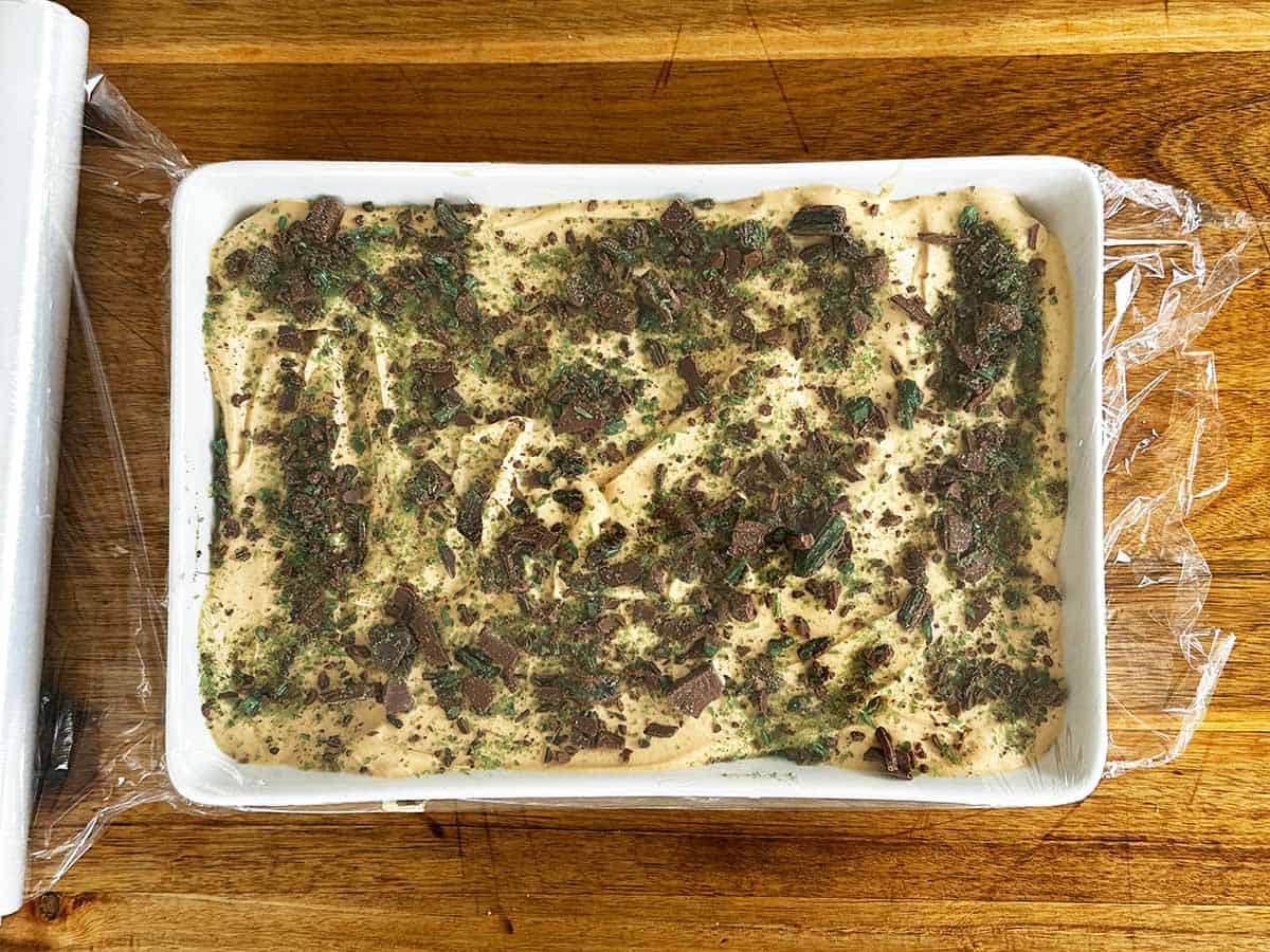 Peppermint crisp tart covered with cling film before chilling in the fridge