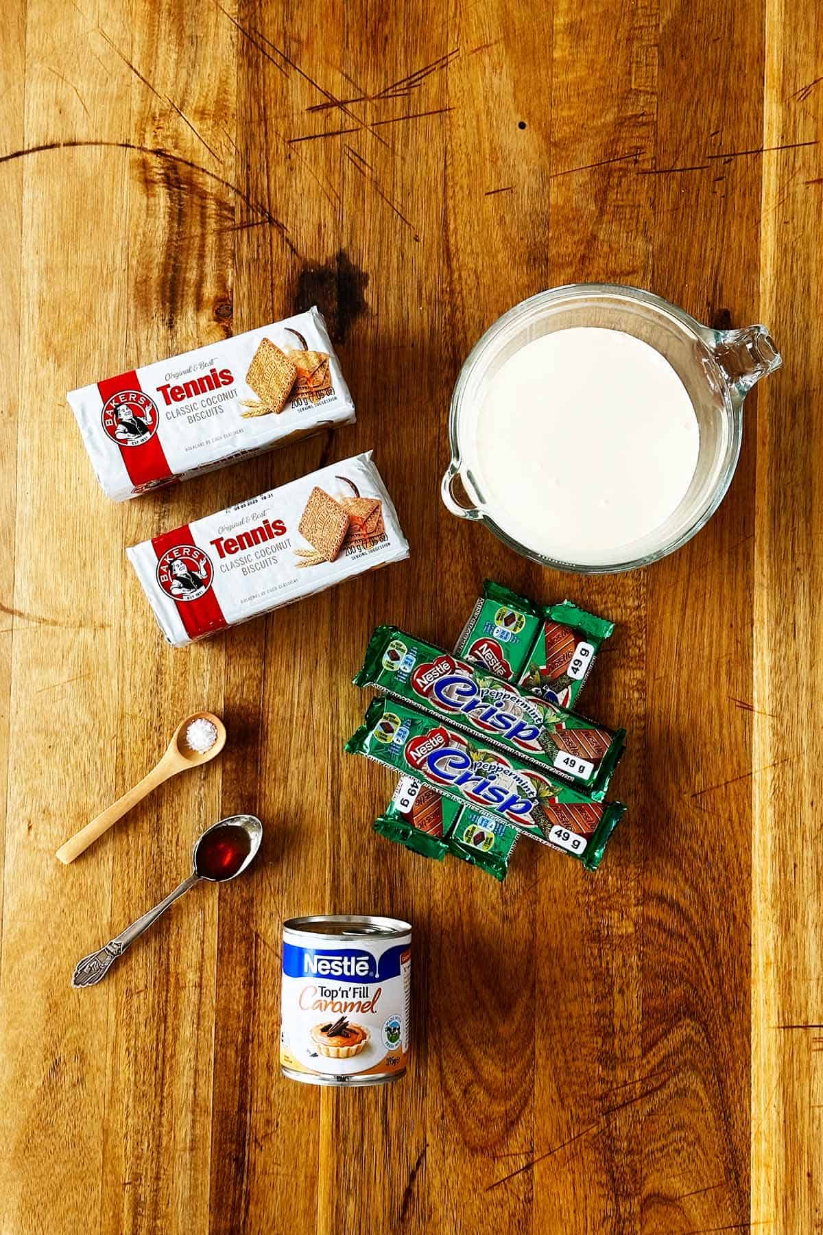 Ingredients for peppermint crisp tart recipe including Tennis biscuits, Top’n’Fill caramel, cream, vanilla, salt and Peppermint Crisp