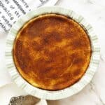 Golden crustless milk tart with cinnamon sugar topping in baking dish