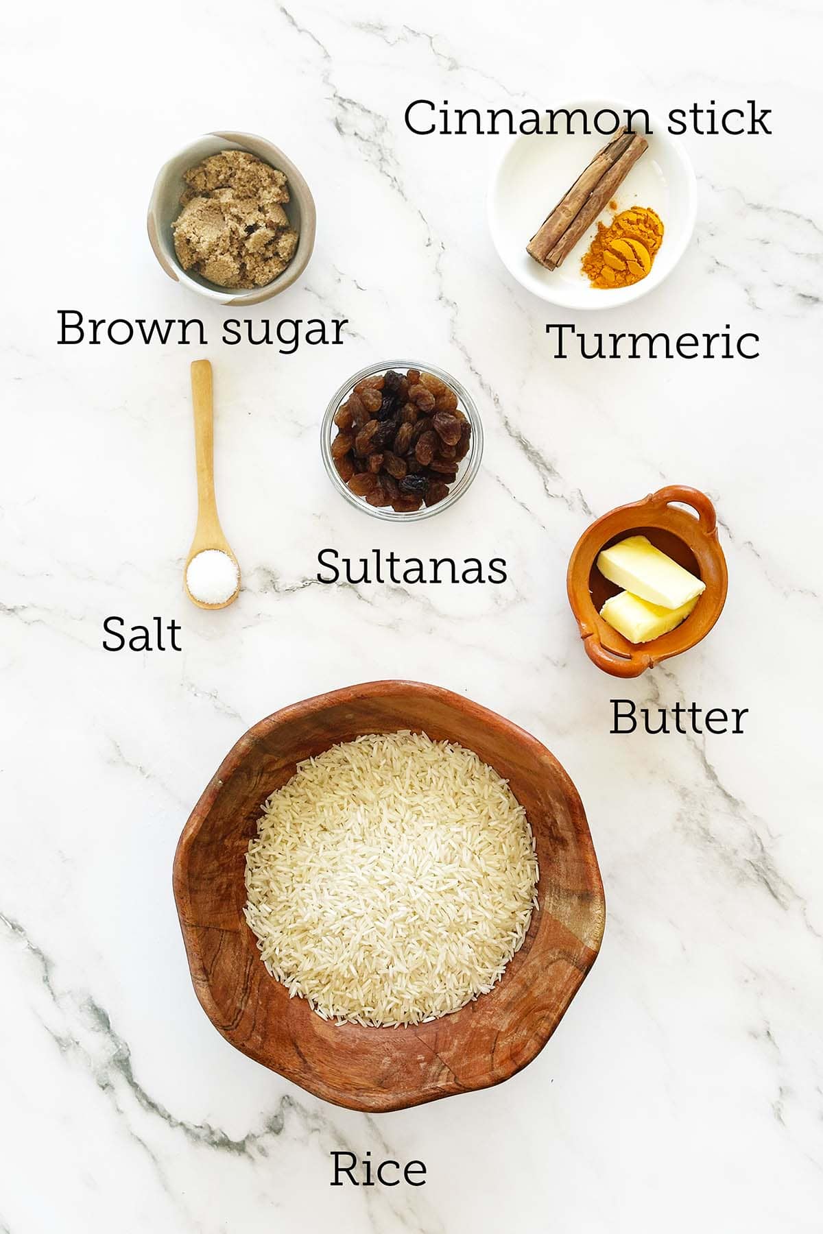 Measured ingredients for South African yellow rice (geelrys) arranged on kitchen bench