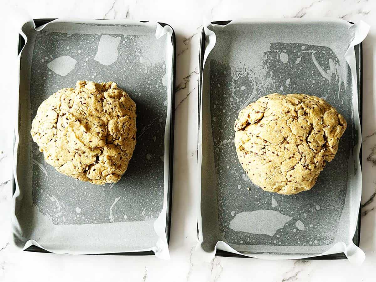 Brown rusk recipe dough divided evenly into two lined pans