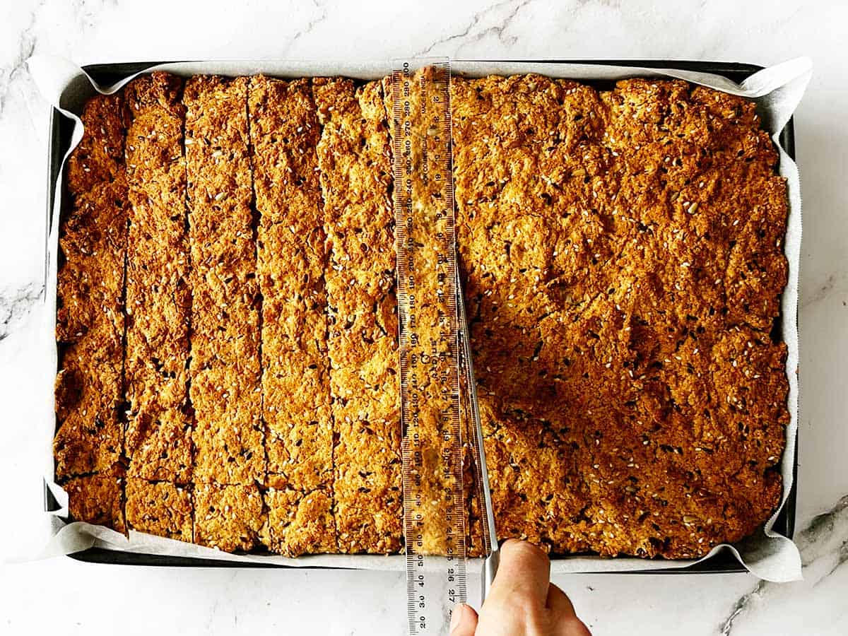 Cutting baked rusks first direction using ruler for health rusk recipe