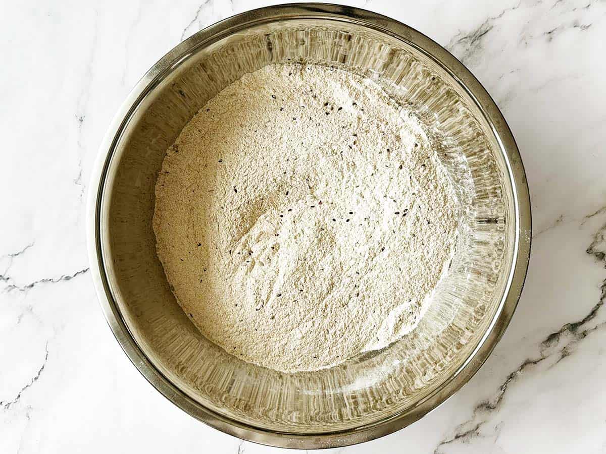 Healthy seed rusks dough mixed with flour, seeds, and bran