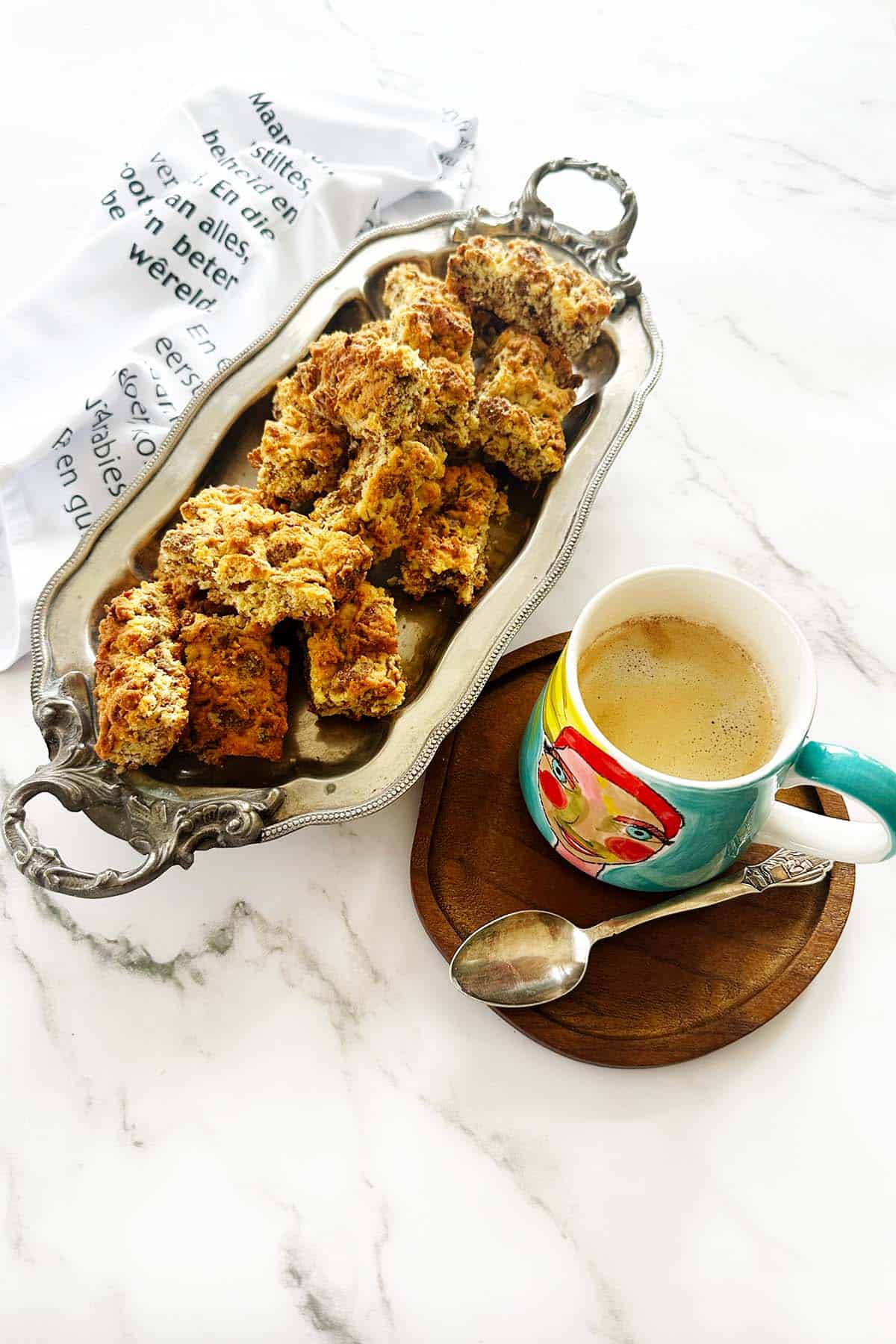 all bran rusks on a serving platter with cup of coffee